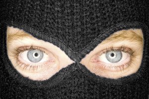 A stock photograph of an attractive woman wearing a balaclava.